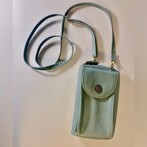 Wallet with crossbody strap in light blue with gold tone metal accents